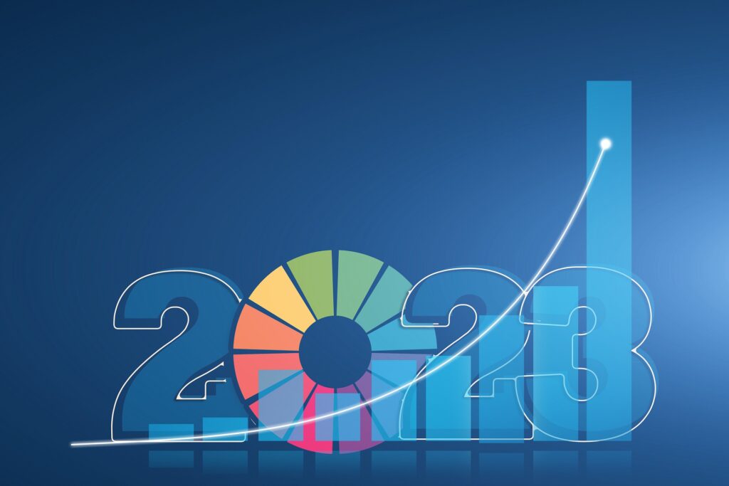 Colorful pie chart and a graph showing an upward swing for e-commerce businesses in 2023
